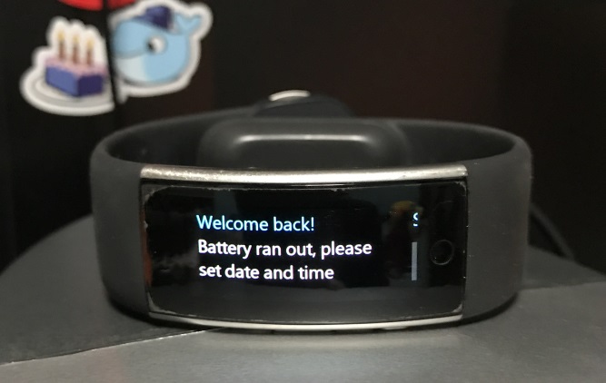 Photo of a Microsoft Band 2 displaying a message to reset the date/time as the battery had drained fully.